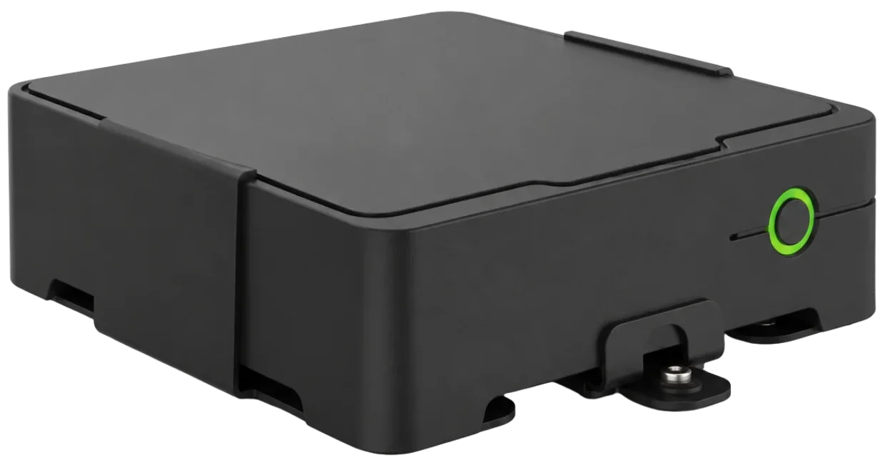 left Angled view of the AXIS W800 System Controller showing black casing, green button, and mounting feet.