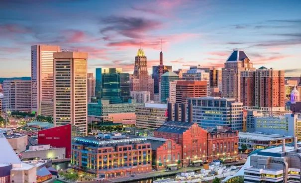 Baltimore city skyline during twilight, a city noted for high crime rates in 2025 danger rankings.