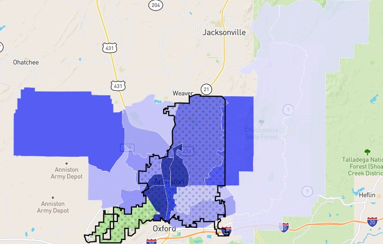 Anniston, Alabama crime density map displaying dangerous zones with shaded blue and black boundary areas.