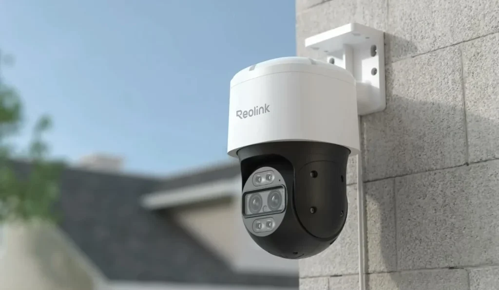Reolink outdoor PoE security camera mounted on house wall for smart home surveillance.