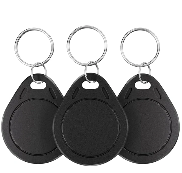 Set of black RFID key fobs used for secure business access control and keyless entry systems.