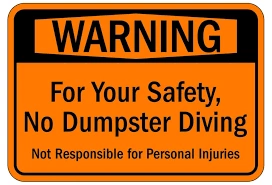 Warning sign prohibiting dumpster diving for safety reasons.