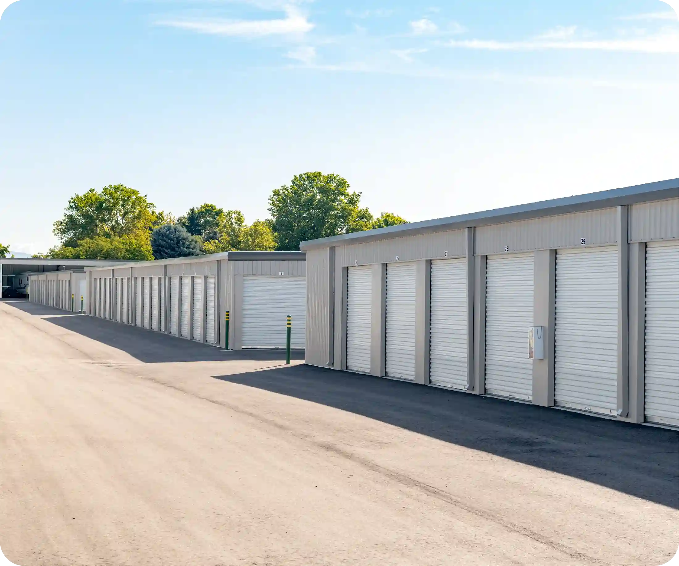Security operator monitoring storage units on screen representing active remote surveillance system.