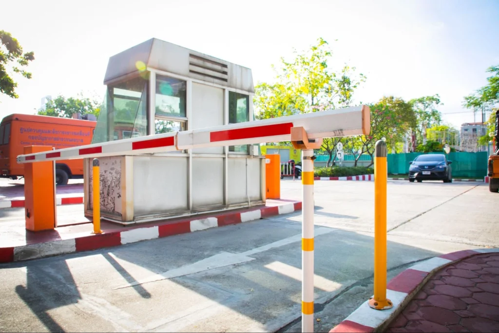 Vehicle entry gate with barrier system for visitor management control.